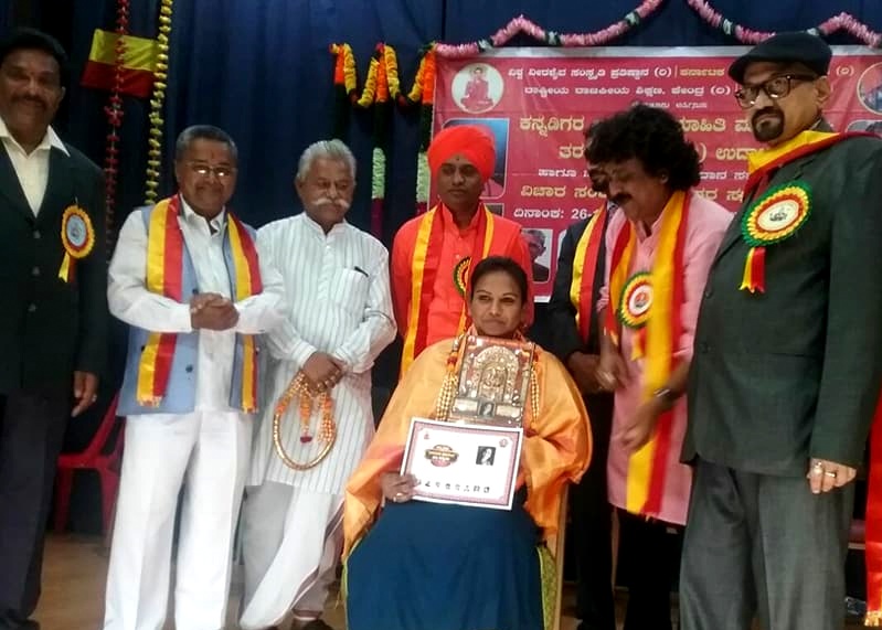 Pushpa Preeya getting an award